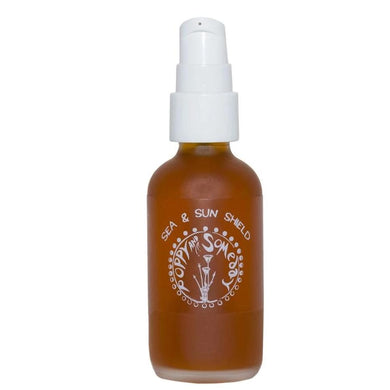 bottle and label of sun and shield body oil made from Michigan grown botanicals by poppy and somday
